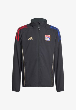 Zwarte sportjas met rode en blauwe strepen op de mouwen, gouden accenten en het logo van Olympique Lyonnais. Voorzien van een rits en zijzakken.