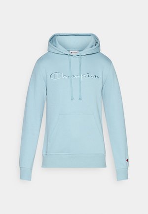 Light blue hoodie made of soft fabric, featuring a front pocket, drawstrings, and contrasting embroidered "Champion" logo.