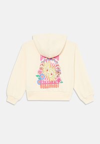Kremfarget cropped hettegenser med et fargerikt grafisk design med en sol, blomster og teksten "Dream Seriously" på ryggen. Myk tekstur.