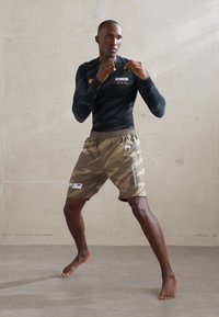 Venum UFC FIGHT WEEK TRAINING SHORTS - Spordišortsid - desert