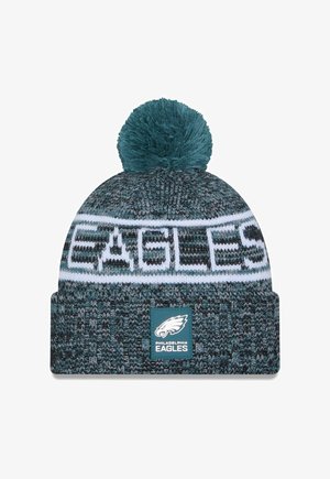 Bonnet tricoté en teal et gris avec une bande blanche portant l'inscription "EAGLES". Doté d'un pompon sur le dessus et d'un patch logo à l'avant.