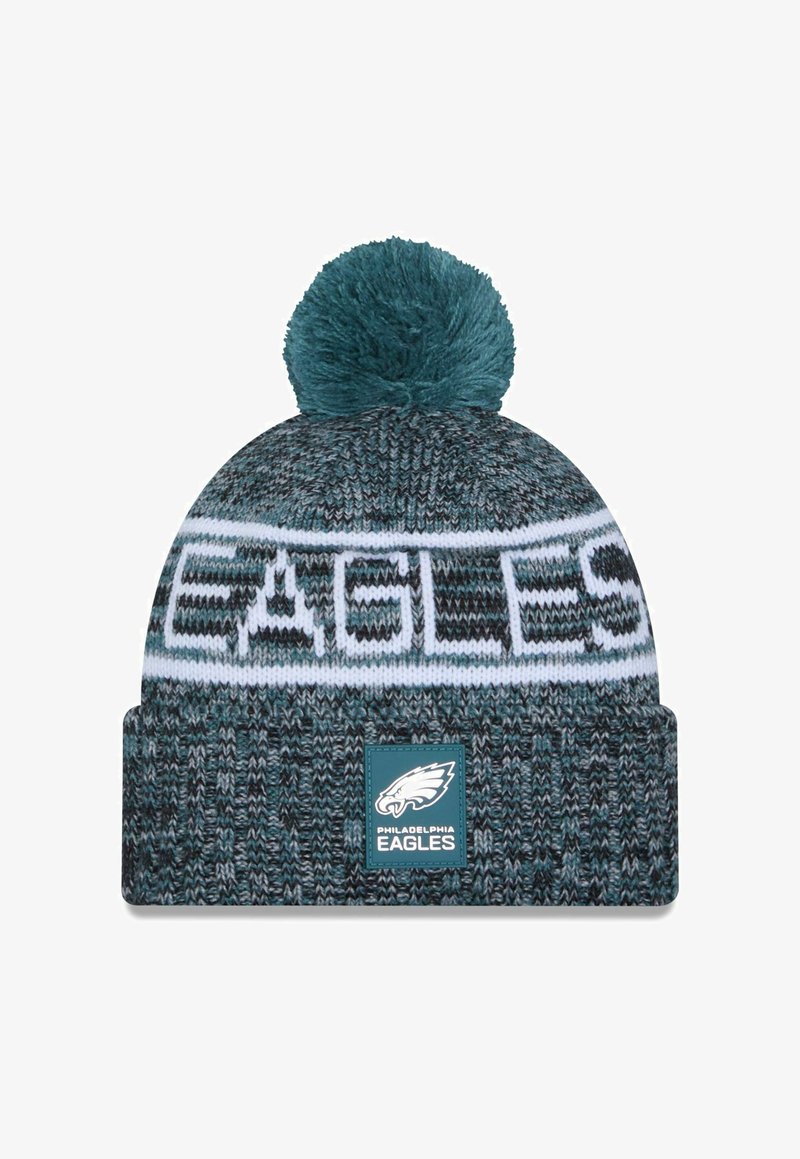 Knit beanie in teal and gray with a white band reading "EAGLES." Features a pom-pom on top and a logo patch at the front.