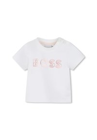 T-shirt blanc en coton avec le mot "BOSS" brodé en rose. Comprend deux boutons-pression sur l'épaule pour un enfilage facile.