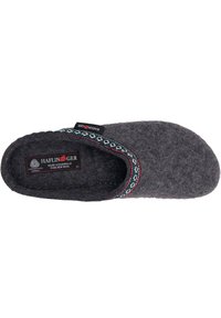 Gray wool slipper with red and teal decorative trim, rounded shape, thick sole, and soft texture. Label reads "HAFLINGER, Pure New Wool."