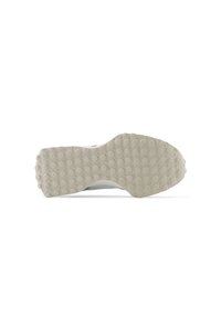 Suela de un zapato con una superficie de goma texturizada de color gris claro que presenta patrones circulares para mejorar el agarre. El borde es redondeado y suave.