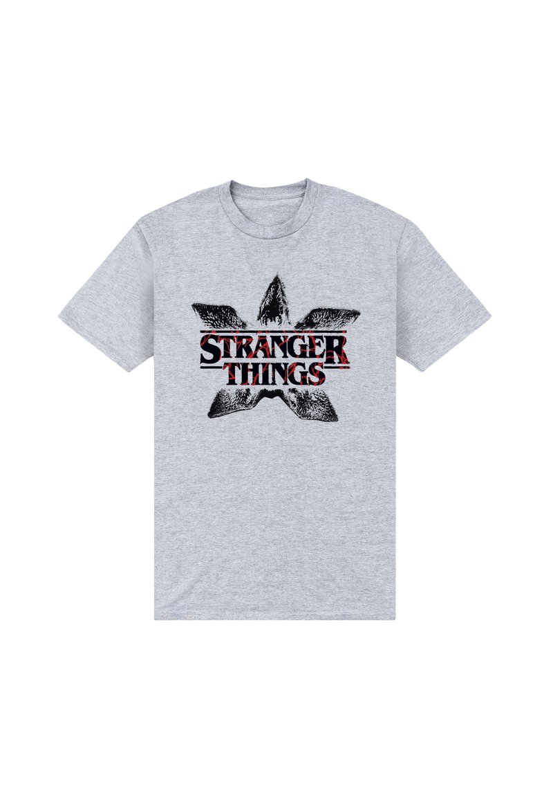 Jasnoszara bawełniana koszulka z czarno-czerwonym wzorem graficznym i napisem "STRANGER THINGS" w abstrakcyjnym wzorze gwiazdy.