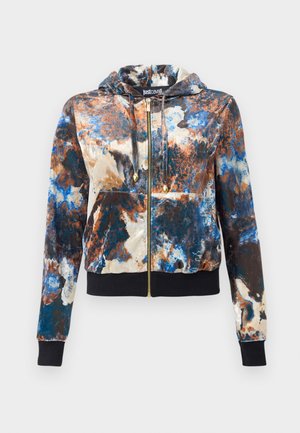 Hooded zip-up jacket in a multicolored print featuring blue, brown, and white hues. Made of soft fabric with ribbed cuffs and hem. Gold zipper accents.