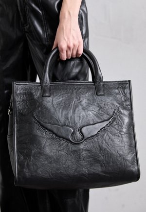 Black leather tote bag with embossed wing design, structured shape, and smooth texture. Features short, dual handles for carrying.