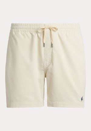 Short beige en velours côtelé avec taille élastique et cordon, avec petit logo brodé foncé sur la partie inférieure de la jambe gauche.