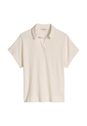 Polo crème à manches courtes avec un col doux et une ouverture subtile en V, présenté à plat sur un fond blanc.