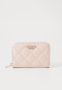 Light pink zippered wallet with quilted pattern, embossed logo, and gold hardware accents. Made from synthetic material with a smooth finish.