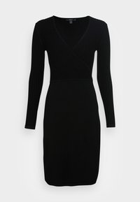 Svart klänning med långa ärmar, V-ringning och ribbad struktur. Fitted design med rak kjol, tillverkad av elastiskt material.