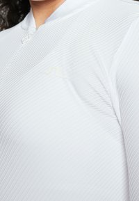 J.LINDEBERG Sports Top s dlouhým rukávem - white