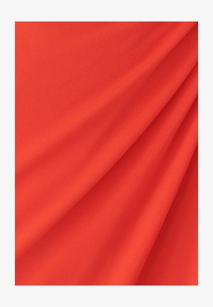 Bright red fabric with a smooth, slightly textured surface, showing folds and drapes, suitable for clothing or upholstery.