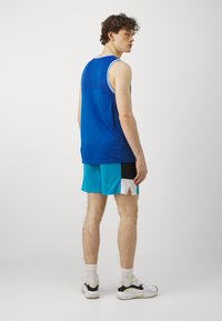 Under Armour ZONE - Sports shorts - ether blue/black