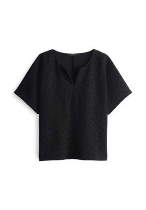 Black top with a V-neck and short sleeves. Textured fabric features a subtle pattern. Relaxed fit, with a straight hem design.