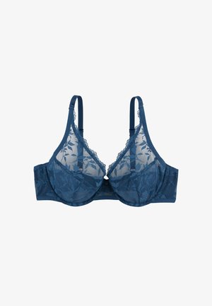 Reggiseno in pizzo blu con motivo floreale, coppe trasparenti, spalline regolabili e un bordo decorativo a scallopatura sul collo. Dettaglio di chiusura frontale.