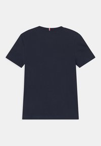 Navy blue cotton t-shirt with a round neck and short sleeves. Features a subtle back seam detail and a small tri-color strip at the collar.