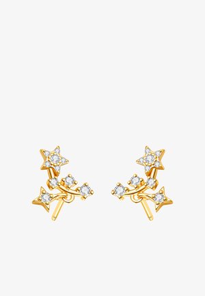 Pendientes dorados en forma de estrella con pequeñas gemas claras dispuestas en un diseño de racimo curvado sobre un fondo blanco.