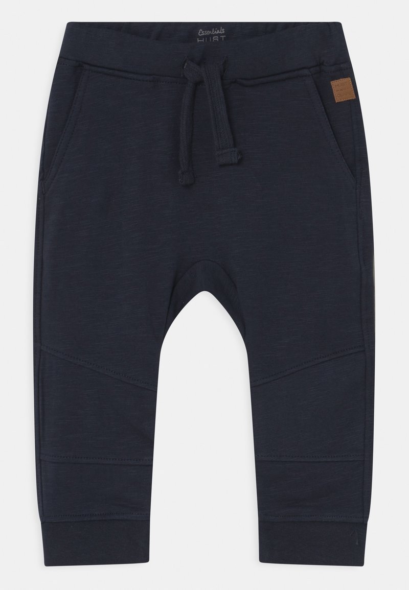 Dunkelblaue Jogginghosen aus weichem Stoff, mit einem elastischen Bund und Zugband, seitlichen Taschen und schmalen Bündchen.