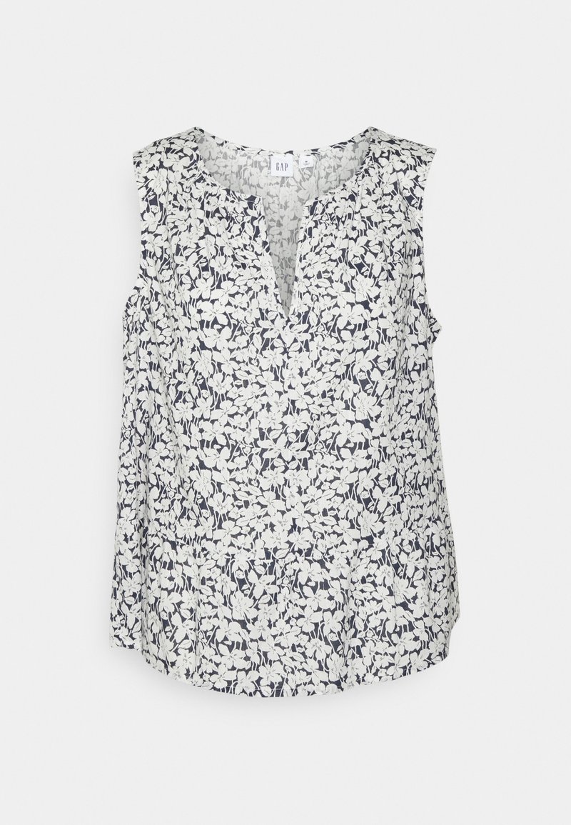 Top sin mangas floral con profundo escote en V, confeccionado en una tela ligera con patrones en azul marino y blanco, con un corte relajado.