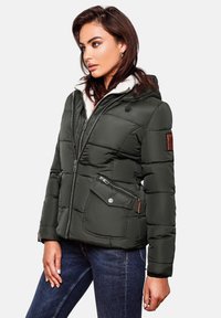Padded jacket in dark green, featuring a faux fur lining, front zipper, and two side pockets with contrasting hardware accents. Hooded design.