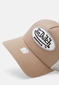 Brown cap with a structured design, featuring a white oval patch with "Von Dutch Originals" in black embroidery and mesh side panels.