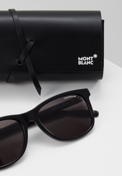 Schwarze Montblanc-Sonnenbrille mit dunklen Gläsern. Begleitet von einem schwarzen Ledercase mit einem in Weiß geprägten Logo.