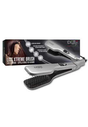 Cepillo alisador de pelo eléctrico plateado con cerdas negras mostrado junto a su embalaje que muestra a una mujer con cabello lacio y castaño.