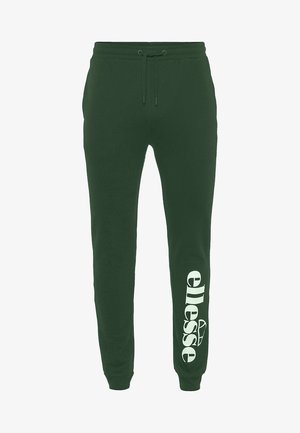 Grønne joggingbukser med elastisk taljebånd og snøre. Har en stor hvid logo trykt på det nederste venstre ben. Blød tekstur.