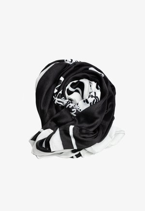 Czarnobiały szalik, wykonany z miękkiego materiału, prezentuje wirujący wzór z wyraźnym kontrastem i gładką teksturą. Skręcony w kształt spirali.