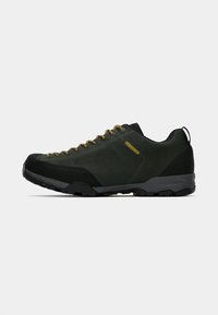 Dark green hiking shoes with black accents and yellow laces. Features a durable suede upper, rubber toe cap, and traction outsole.
