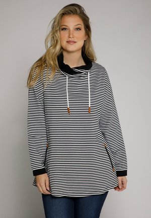 Pull-over à rayures noires et blanches avec un col drapé, des manches longues et des poches latérales. Dispose de cordons de serrage avec des accents bruns. Tissu texturé.