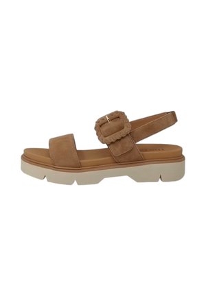 Sandali in suede marrone con una fascia larga, fibbia regolabile e una suola bianca chunky. Presentano un dettaglio hardware quadrato testurizzato.