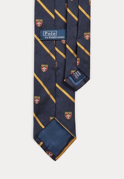 Tmavě modrá hedvábná kravata se žlutými diagonálními pruhy a malými červenými, žlutými a bílými štíty, označená Polo od Ralph Laurena, ručně vyrobená v Itálii.