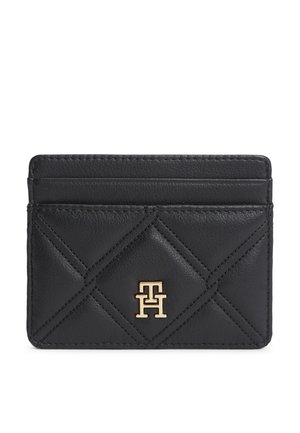 Porte-cartes en cuir noir avec motif losanges matelassés et logo métallique doré "TH" centré à l'avant.