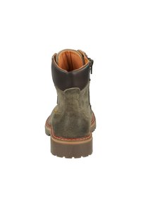 Braune und grüne Wildleder-Stiefelette mit hohem Kragen, orangefarbenem Futter und seitlichem Reißverschluss. Sie verfügt über eine strapazierfähige Gummisohle für guten Halt.