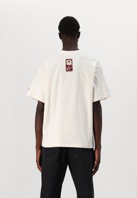 Marimekko NOPEUS UNIKKO UNISEX - T-shirts print - off white