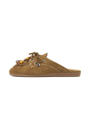 Brown suede slip-on shoe with tasseled laces and wooden bead accents, flat sole, and detailed stitching on a white background.