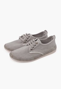 Grey canvas shoes with rounded toe, lace-up design, contrasting stitching, and a textured rubber sole.