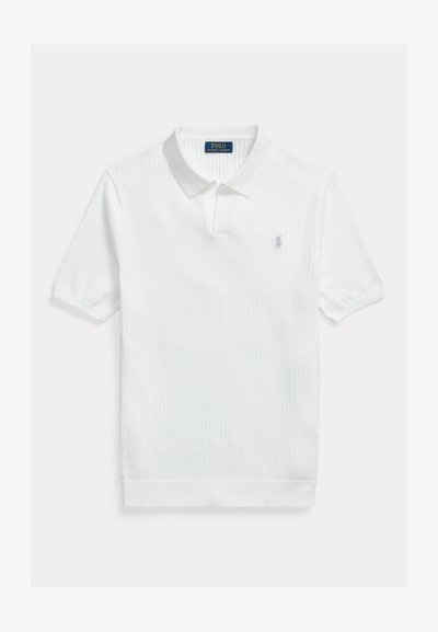 White ribbed polo shirt with a classic collar, short sleeves, and an embroidered logo on the left chest. Soft texture and clean design.
