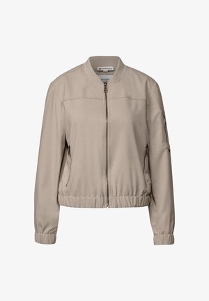 Veste bomber beige en tissu lisse, avec une fermeture éclair frontale, des poches latérales, des poignets élastiques et un ourlet légèrement froncé.
