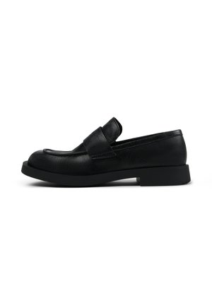 Black leather loafers with a low, thick sole; features a wide strap across the top and a rounded toe; textured finish.