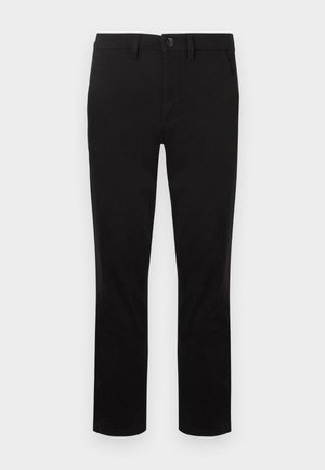 Black trousers made of a smooth fabric, featuring a straight cut, belt loops, and a single button closure at the waist. No patterns.