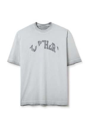 Grey cotton t-shirt with short sleeves, featuring the text "NO WHERE" in a contrasting design across the chest. Simple and casual style.
