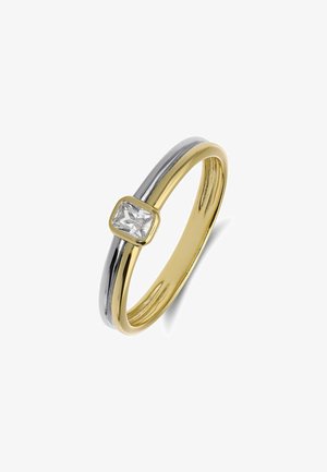 Bague à jonc en or et argent avec une petite pierre précieuse rectangulaire claire sertie dans un chaton en or sur fond blanc.