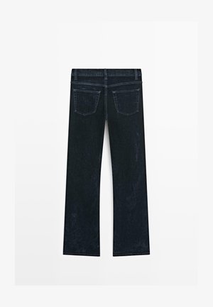 Dark denim jeans with a straight leg design, featuring a mid-rise waistband and two back pockets, showcasing a smooth, textured finish.