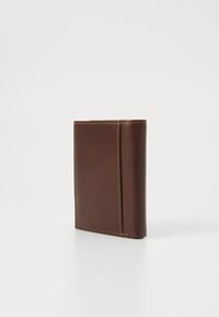 Brown leather wallet with a smooth texture, featuring visible stitching along the edges and a slim, rectangular shape.