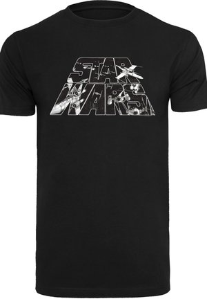 Black cotton T-shirt featuring a graphic design with "STAR WARS" text, depicting spaceships and a starry background in gray.