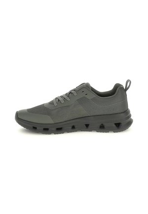 Scarpa da ginnastica atletica grigio scuro con tomaia in mesh e sintetico, chiusura con lacci, suola spessa ventilata e linguetta sul tallone, vista laterale.